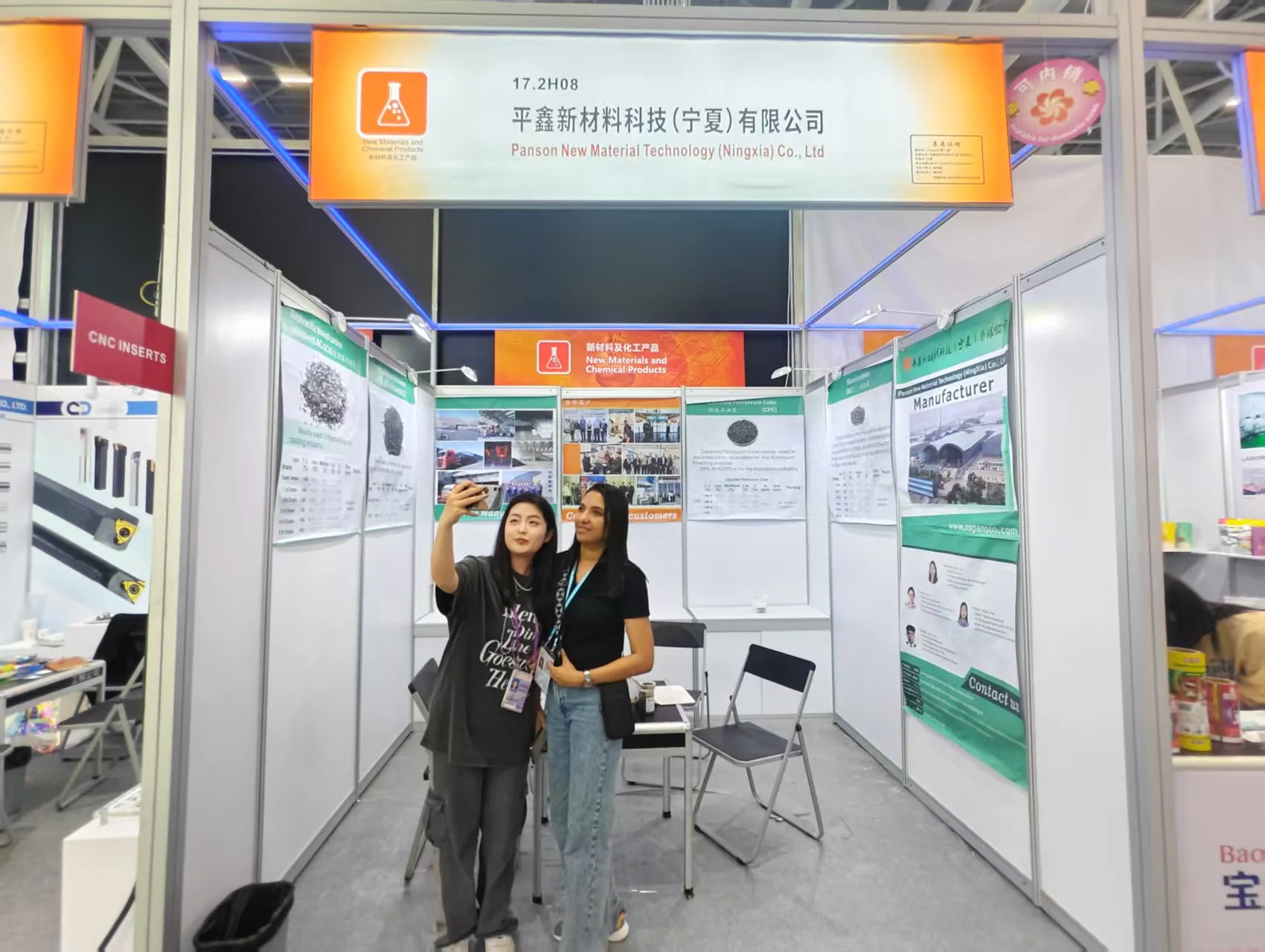 Exhibition booth with product samples and visitors