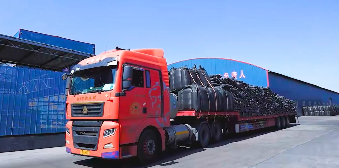 Truck loading bagged carbon additive shipment for export